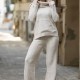 Compleu tricot dama crem cu bluza pe gat si pantalon croi evazat